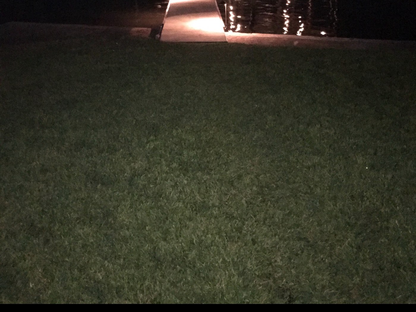 Boat dock lighting from the lawn installed by Longhorn Electric